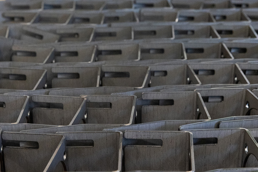 rows of laser cut and bent parts manufactured by UK sheet metal fabrication company