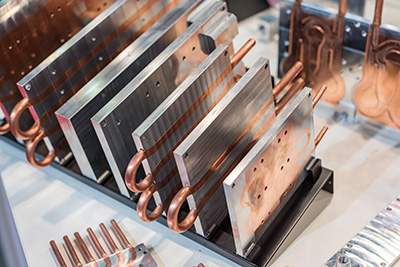 Copper CNC Machining at Universal Fabrications (Coventry) of Aluminum-copper heat sink plates for industrial electronics. 