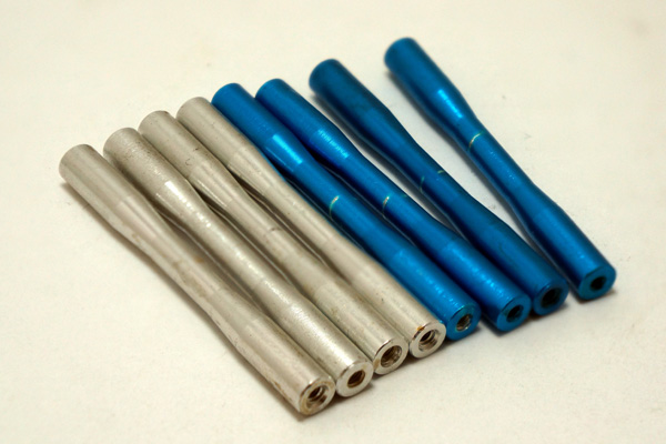 multiple metal painted parts representing parts manuafctured at Universal Fabrications