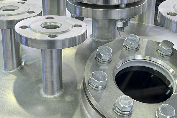 Various parts stainless steel pipes, flanges and plugs manufactured by Universal Fabrications (Coventry) specialists in stainless steel machining serving Stoke on Trent businesses