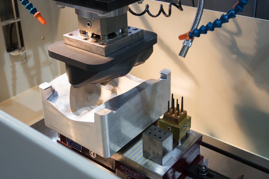 Custom machining fixture supporting a fabricated component during CNC machining