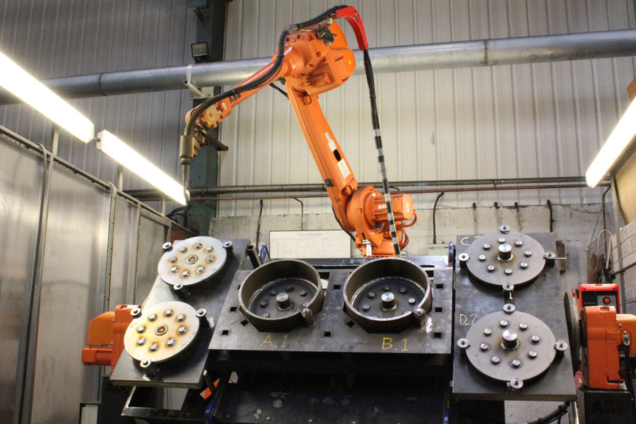 Robotic welding cell with a fabricated steel structure at Universal Fabrications