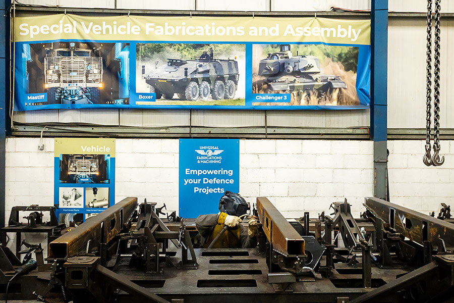 welder at universal fabrications in Coventry welding a fixture